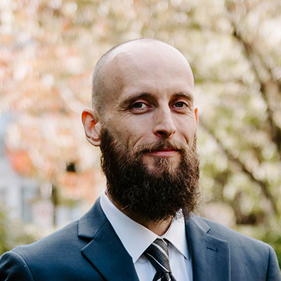 Rob, smiling man wearing a suit